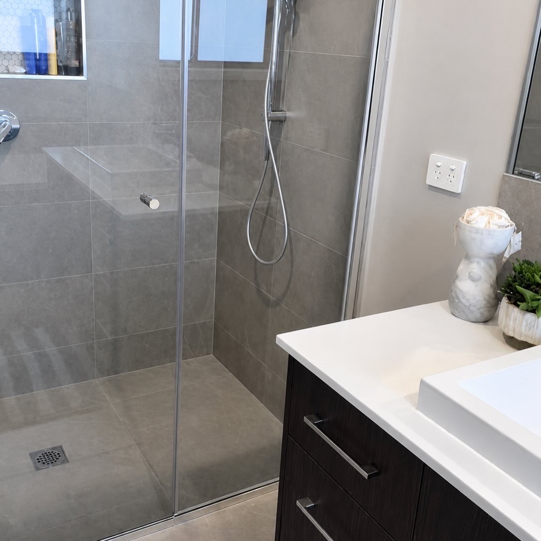 A sparkling shower recently cleaned by Kas — spotless glass and polished tiles.